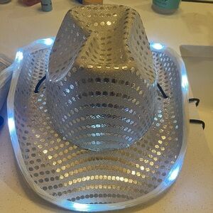 White w/ white polka dot flashing cowboy hat. Bachelorette party vibes